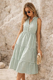 Sage green striped midi dress by FJØRNA featuring a flowing silhouette and classic vertical stripe pattern.