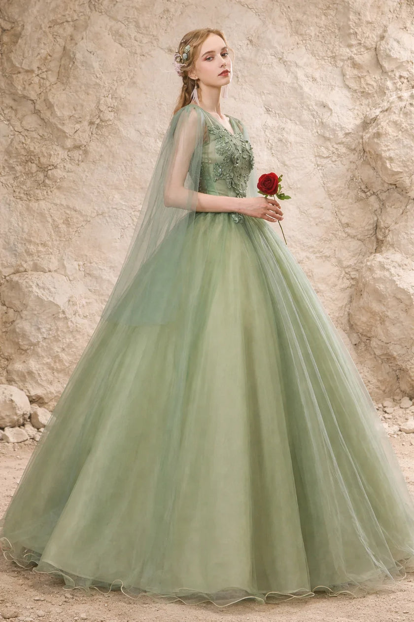 Sage green tulle wedding guest dress by FJØRNA featuring a flowing, elegant design perfect for special occasions.