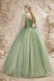 Sage green tulle wedding guest dress by FJØRNA featuring a flowing, elegant design perfect for special occasions.