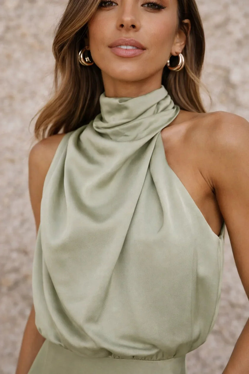 FJØRNA sage green satin dress with elegant flowing fabric and V-neck design, perfect for formal occasions.