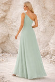 Sage green FJØRNA bridesmaid dress with elegant flowy fabric and sleeveless design, perfect for wedding attire.