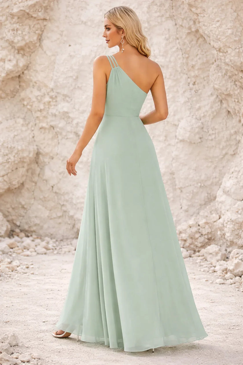 Sage green FJØRNA bridesmaid dress with elegant flowy fabric and sleeveless design, perfect for wedding attire.