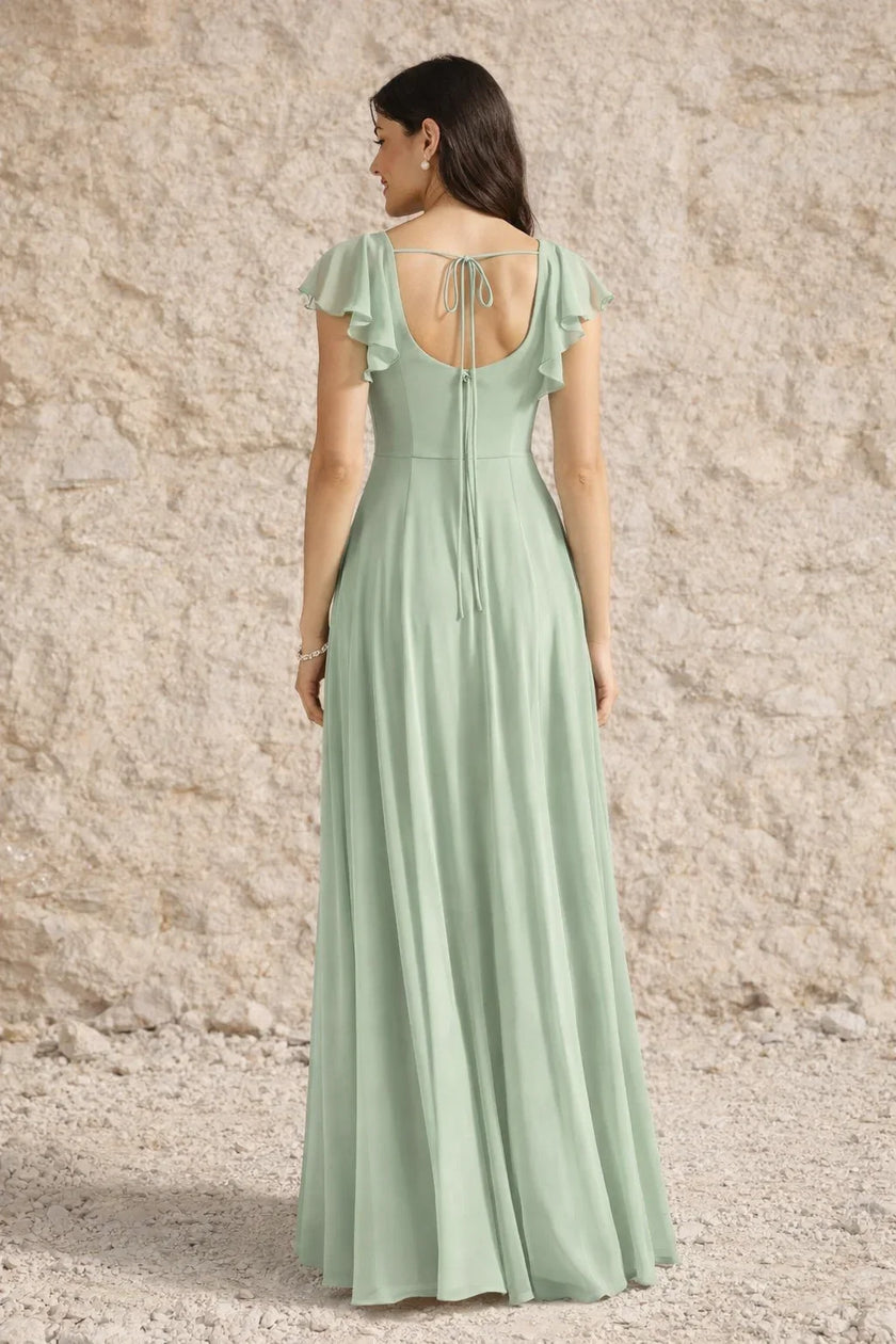 Sage green plus size FJØRNA dress with a slit, flowing fabric, and elegant design for a stylish look.