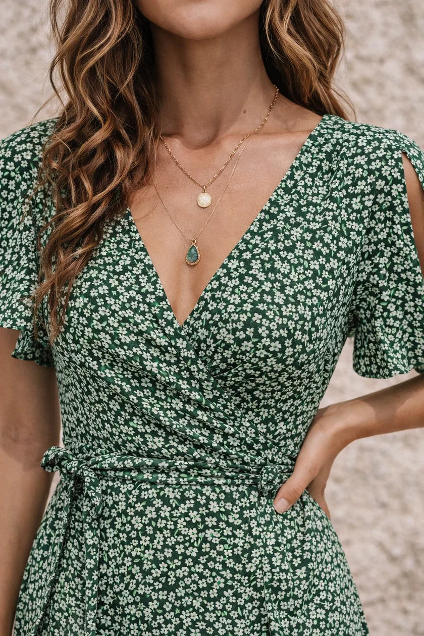 Dark sage green FJØRNA dress with long sleeves and a flowing silhouette, perfect for casual or semi-formal occasions.