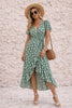 FJØRNA sage green wrap dress with a slit, featuring a flowy design and elegant neckline, perfect for stylish occasions.