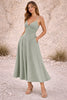 Dusty sage green FJØRNA dress featuring a flowing design and soft fabric, perfect for casual or semi-formal wear.