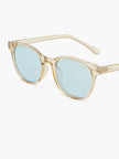 Women's round sunglasses with UV protection and acetate frame by FJØRNA, featuring stylish circular design.