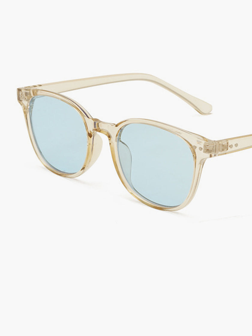 Women's round sunglasses with UV protection and acetate frame by FJØRNA, featuring stylish circular design.