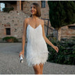 Elegant mini dress for women by FJØRNA featuring fringe details, perfect for cocktail parties, shown in a stylish black design.