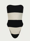 Women's off-shoulder striped jumpsuit with high leg cut and contrast stripes, by FJØRNA, featuring a stylish, modern design.