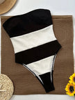 Women's off-shoulder striped jumpsuit with high leg cut and contrast stripes, by FJØRNA, featuring a stylish, relaxed fit.