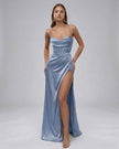 Elegant blue satin maxi dress by FJØRNA with a high slit, flowing silhouette, perfect for formal occasions and evening wear.