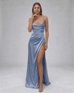 Elegant blue satin maxi dress for women by FJØRNA featuring a high slit and modern, fashion-forward silhouette.