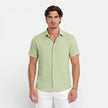 Men's short sleeve linen cotton blend shirt by FJØRNA, breathable summer fit, casual men's shirt in white, laid flat.
