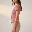 FJØRNA women's summer gingham blouse with V-neck, shown from the side, lightweight and stylish top for warm weather.