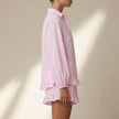 FJØRNA women's striped ruffle summer two-piece co-ord set, showing a side view of the stylish, lightweight blouse and matching shorts.