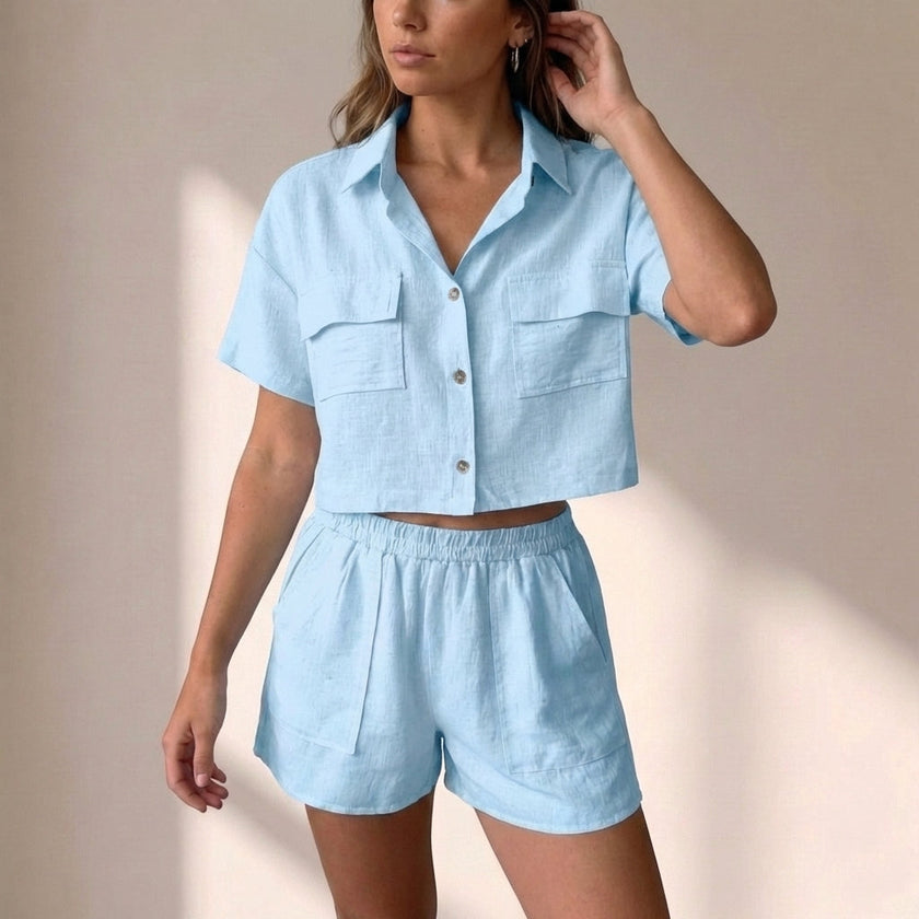 Sky blue FJØRNA relaxed collared two-piece shorts set in lightweight textured woven fabric, shown on a model.