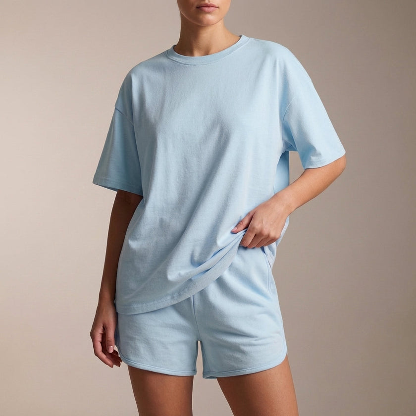 Sky blue FJØRNA summer two-piece women's co-ord set with drawstring details, featuring a stylish crop top and matching shorts.