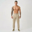 FJØRNA tailored cream trousers showing a slim fit design with clean lines and a smooth fabric finish.
