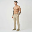 Cream tailored trousers by FJØRNA, featuring a fitted waist and classic straight-leg design, displayed on a model.