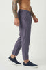 FJØRNA cropped linen trousers in indigo color, featuring a relaxed fit and lightweight fabric, perfect for casual wear.