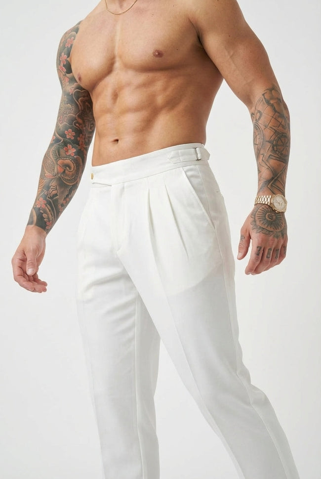 Men's tailored white trousers by FJØRNA, featuring a slim fit design and classic style, shown on a model front view.