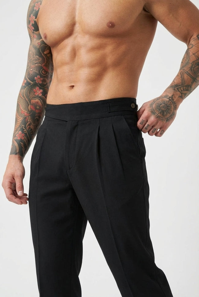 Men's black tailored trousers by FJØRNA, featuring a slim fit design and classic style, shown on a mannequin.