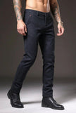 Slim-fit blue trousers by FJØRNA, showcasing the tailored design and sleek fit on a model.