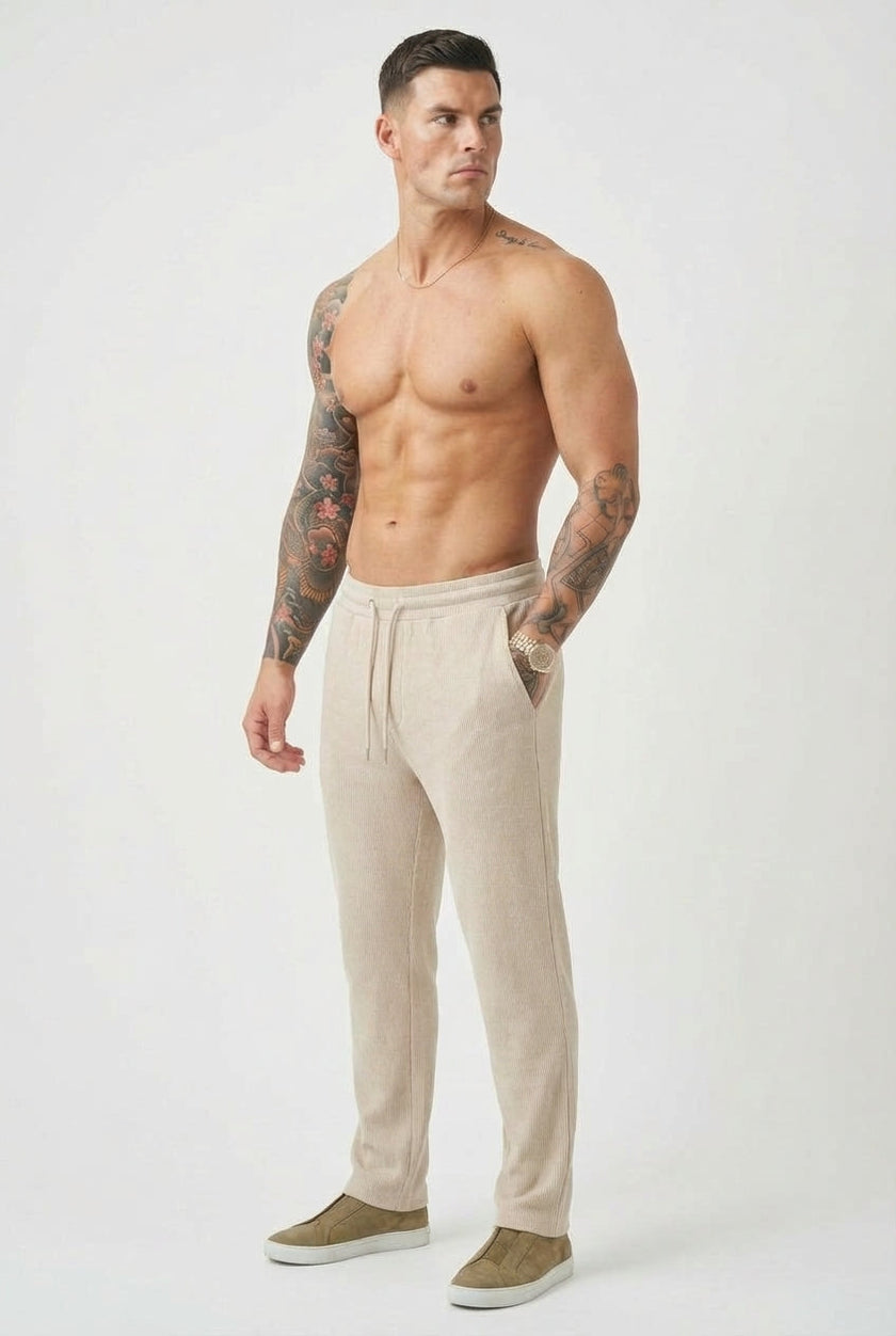 FJØRNA relaxed knit trousers in khaki, showcasing a comfortable fit and soft fabric, styled casually on a model.