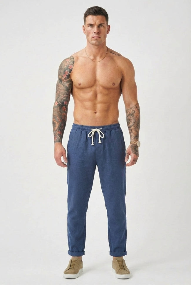 Men's linen tailored trousers by FJØRNA, showing a pair of stylish, beige linen pants with a tailored fit and classic design.