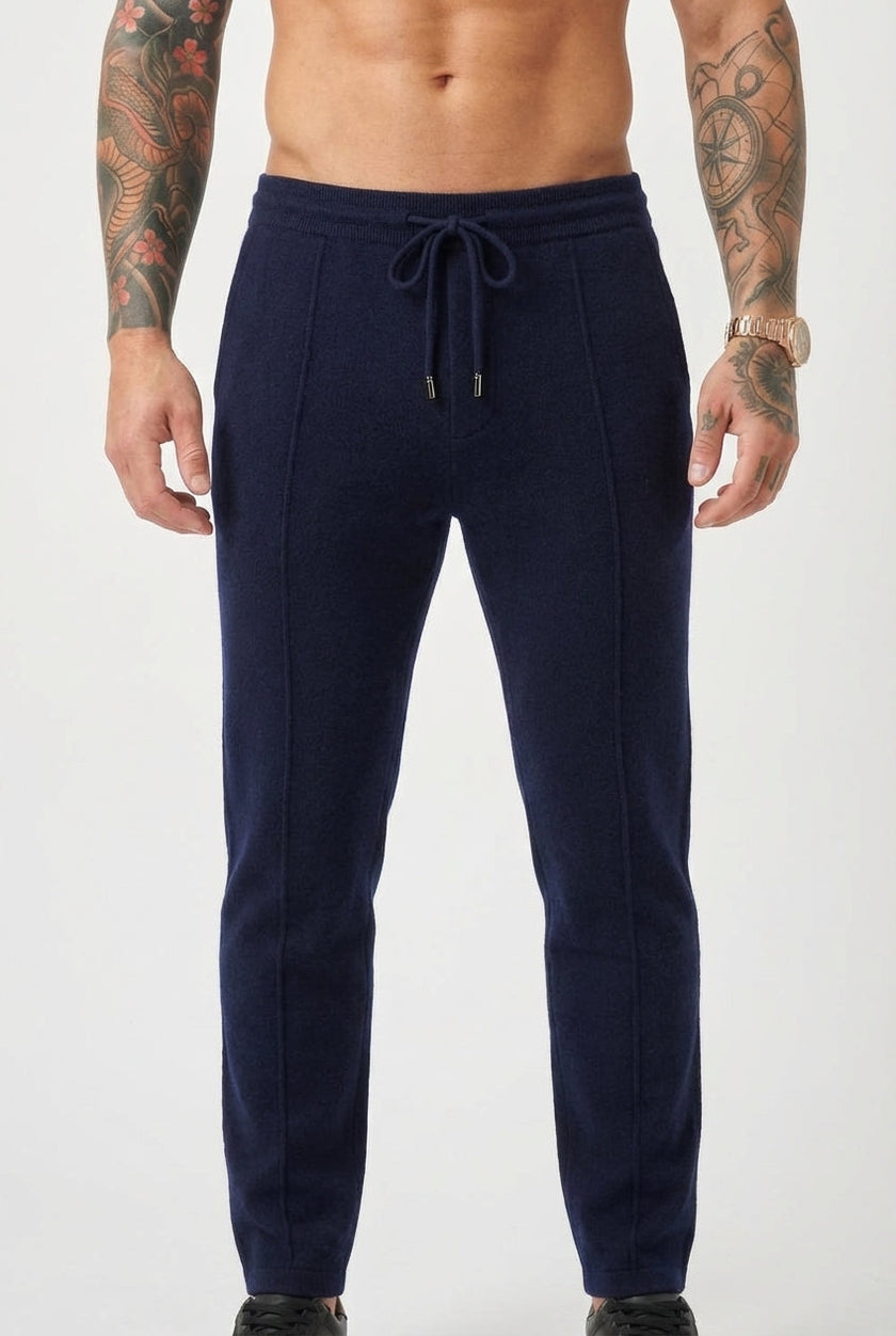 Navy Merino wool trousers by FJØRNA, featuring a tailored fit and classic design, displayed on a model.