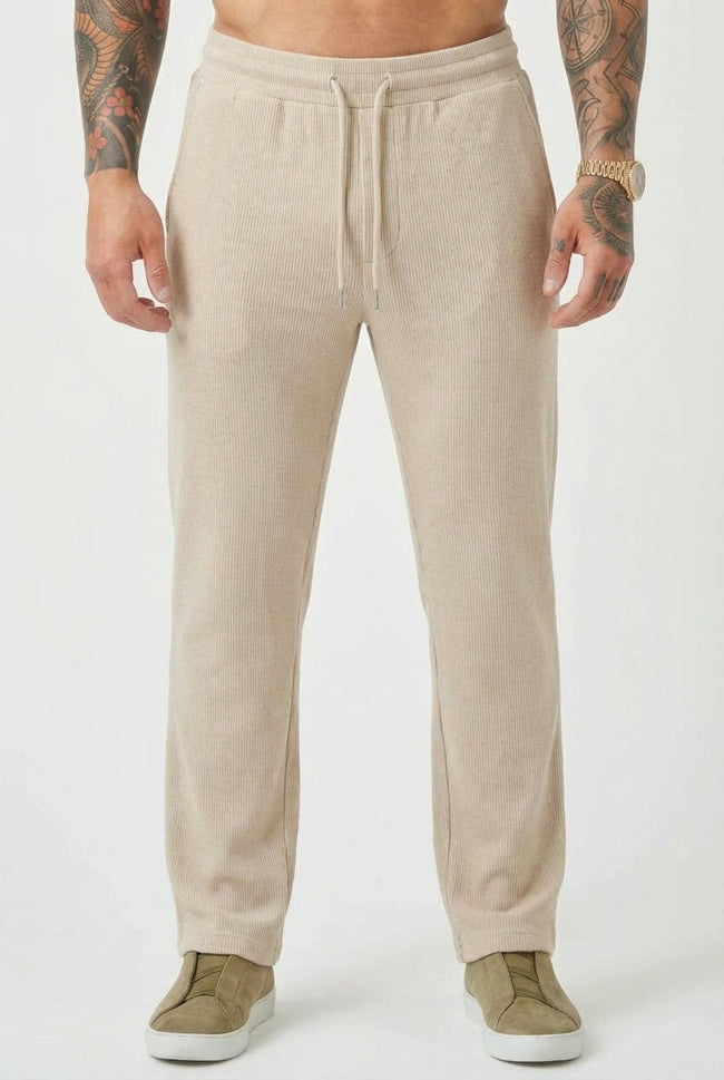 Men's relaxed fit knit trousers in khaki by FJØRNA, featuring a comfortable waistband and casual style.