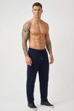 FJØRNA navy merino wool trousers displayed on a model, showcasing tailored fit and soft, high-quality wool fabric.