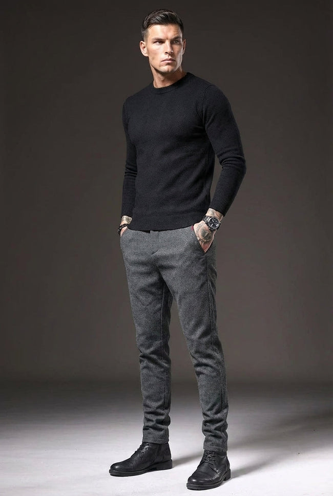 Slim-fit men's light grey trousers by FJØRNA, showing a close-up of the tailored waistband and fabric texture.