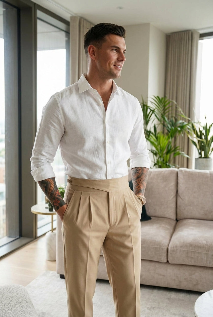 FJØRNA tailored cream trousers displayed on a model, featuring a slim fit and classic waistband for a polished look.