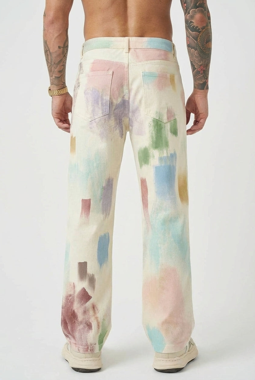 FJØRNA painted black trousers displayed on a model, showcasing slim fit and stylish design with painted detailing.