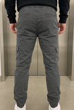 FJØRNA grey cargo jogger trousers with multiple pockets, relaxed fit, and elastic cuffs, displayed on a model.