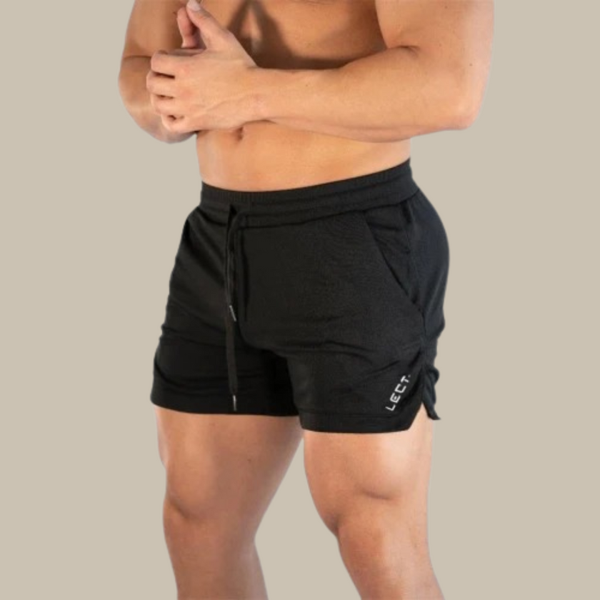 Men's sporty swim shorts by FJØRNA, close-up of fitted, sleek men's swimwear with a vibrant design and elastic waistband.