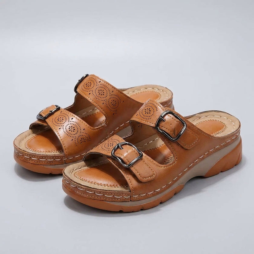FJØRNA women's orthopedic buckle platform slide sandals in studio brown with adjustable straps and cushioned soles.