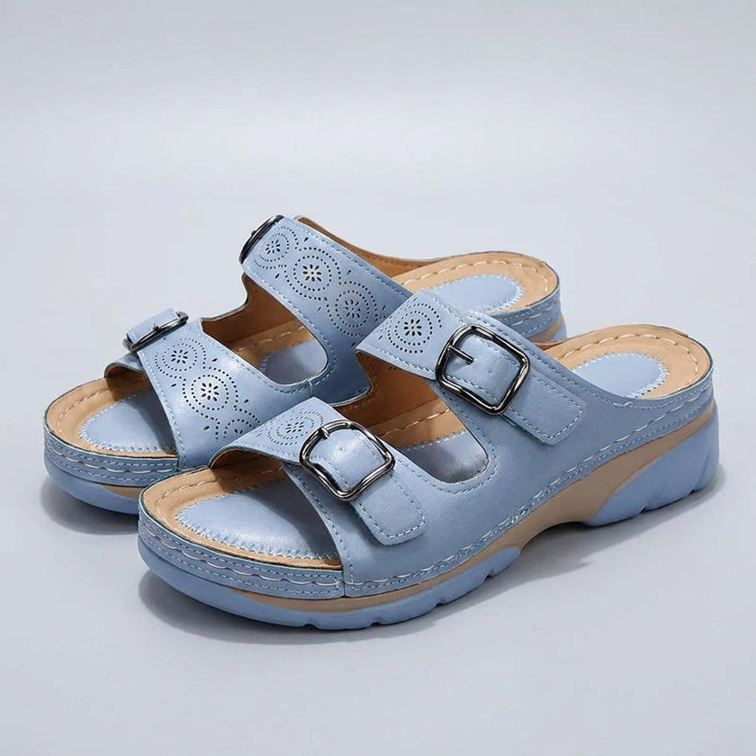 FJØRNA orthopedic buckle platform slide sandals for women in light blue with adjustable straps and cushioned soles.