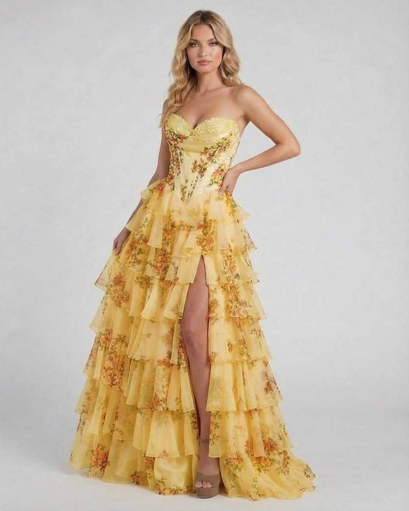 Yellow floral chiffon maxi dress for women by FJØRNA, strapless corset style with tiered flowing fabric and sunset-inspired design.