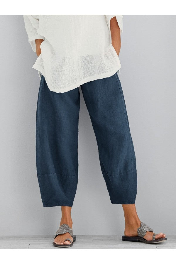 FJØRNA women's lightweight summer tapered trousers with elastic waist, breathable fabric, and loose-fit cropped design.