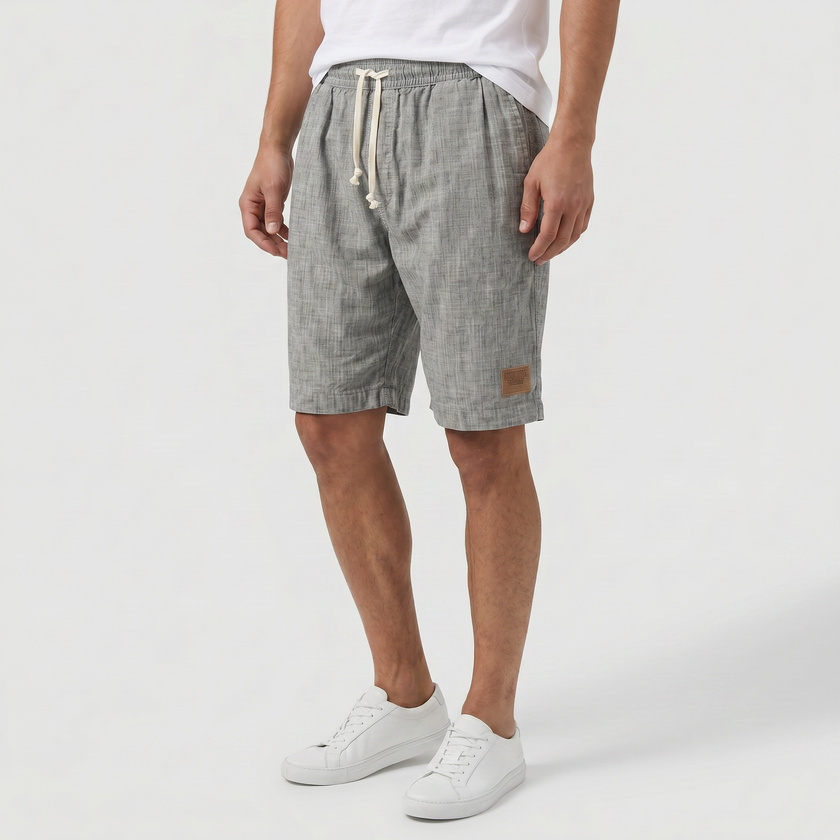 Men's linen shorts with elasticated waist and drawstring, FJØRNA summer beach shorts for casual wear.