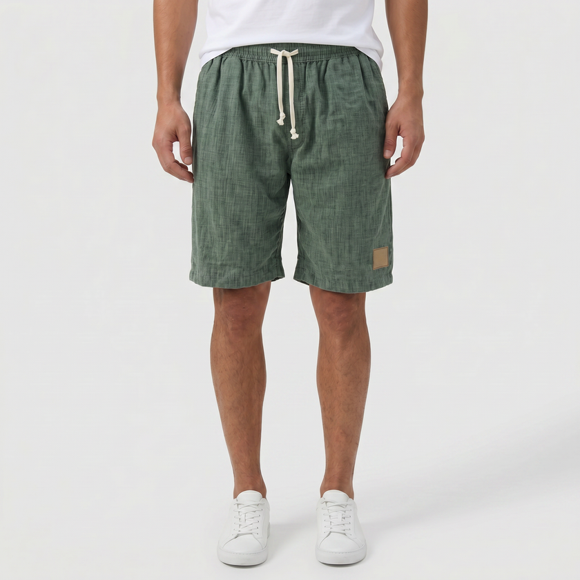 FJØRNA men's linen shorts with elasticated waist and drawstring, perfect for summer beachwear and casual wear.
