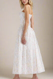 FJØRNA Tasmin women's white printed midi dress, bodycon style perfect for day to night wear, showcased on a model.