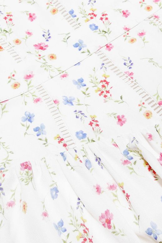 FJØRNA Tasmin women's white print midi dress with bodycon fit, perfect for day to night wear, showcasing a stylish printed design.