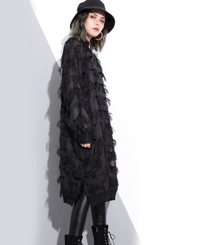 White FJØRNA tassel see-through dress with delicate tassel details and sheer fabric, stylish and elegant for special occasions.