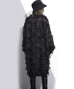 White tassel see-through dress by FJØRNA featuring lightweight fabric and intricate tassel details, perfect for stylish occasions.