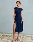 FJØRNA women's polka dot midi dress with round neckline and cutout detail, stylish and feminine for casual or dressy occasions.