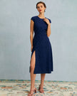 Navy polka dot midi dress for women with round neck and cutout details by FJØRNA, stylish and elegant for various occasions.
